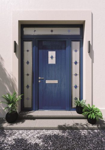 Blue entrance door surrounded by decorative glazing