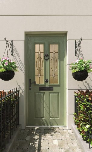 Green entrance door with decorative glazing panels